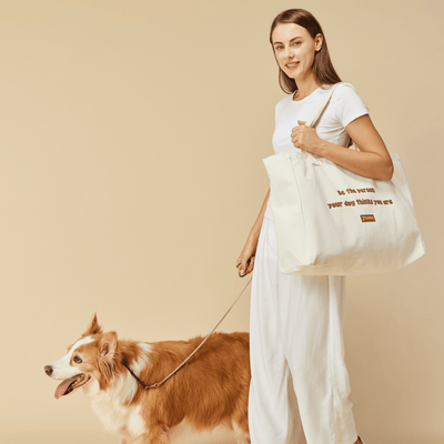 'Be the person your dog thinks you are' Tote Bag